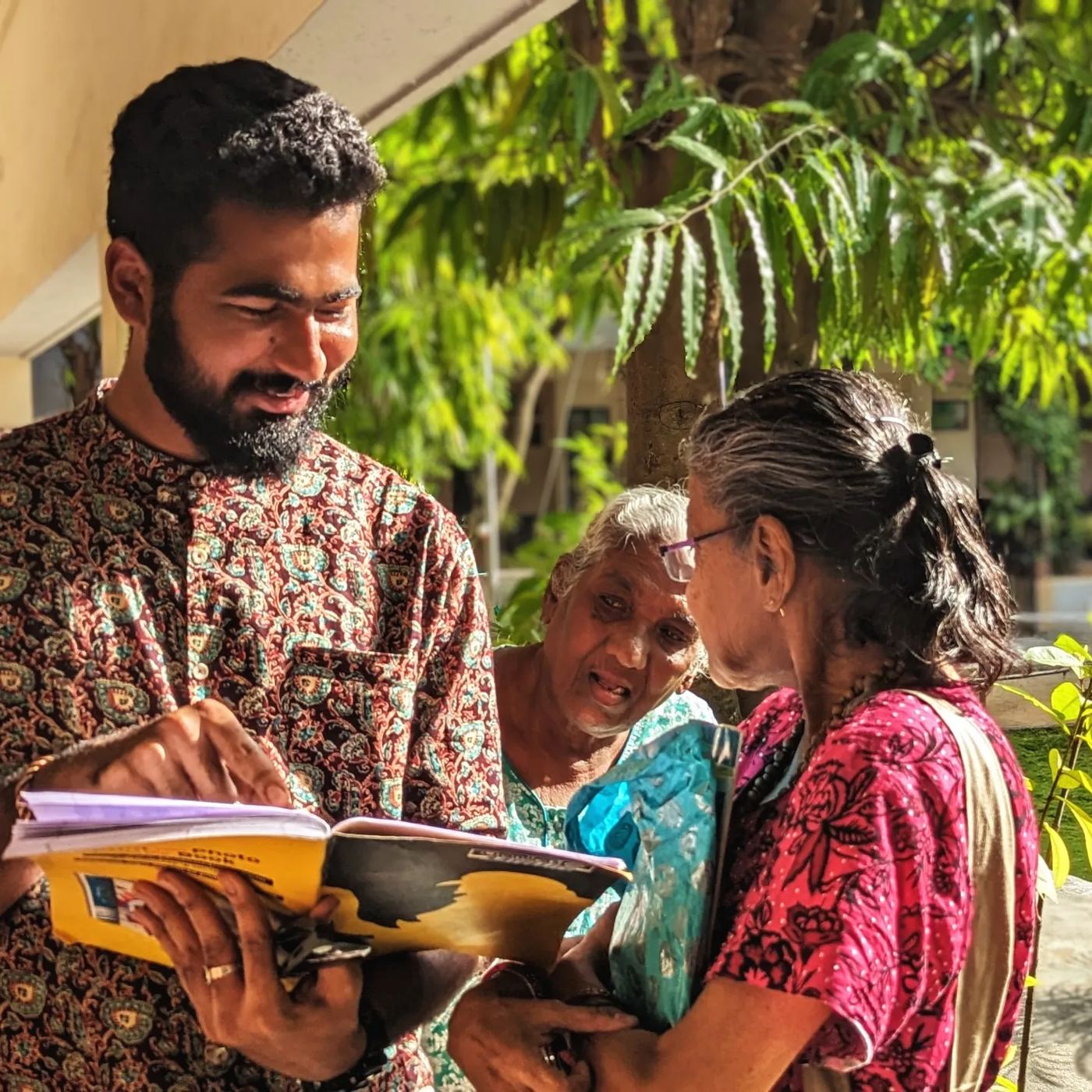 Kadiri Raghu Vamsi in conversation with elderly women community members during a Marpu Foundation field documentation visit
